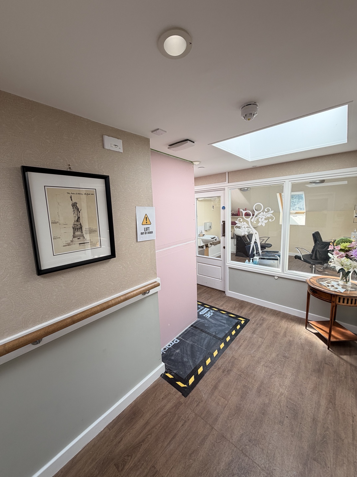 Hoarding installed in an occupied care environment